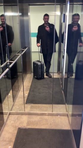 Traveler with luggage spotted in Berlin elevator