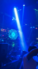Nightclub scene captured in Burgas with colorful lighting, dancing crowds