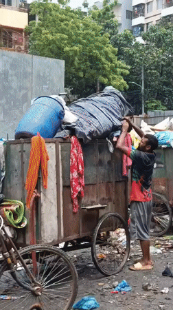 Morning street life and waste work in central Dhaka
