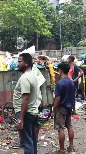 Morning street life and waste work in central Dhaka