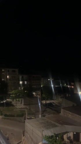 Evening scenes captured in Yeghegnadzor show residential buildings, violet plants