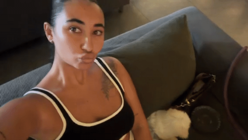 Woman and small white dog captured at Indonesian lounge cafe