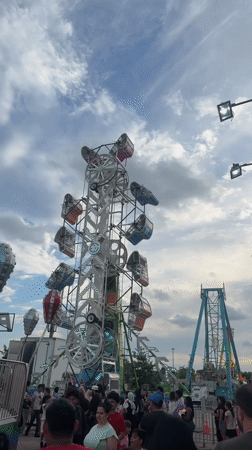 Summer carnival night in Niles with illuminated rides and crowds