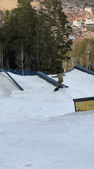Snowboarders practice rail tricks at terrain park with mixed results