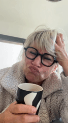 Woman with patterned mug observed making expressions in Chambœuf