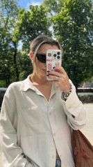 Woman takes sidewalk selfie in Voronezh, Russia