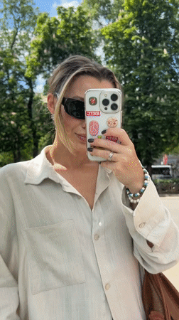 Woman takes sidewalk selfie in Voronezh, Russia