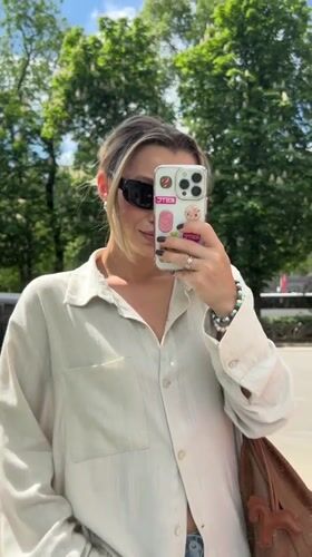 Woman takes sidewalk selfie in Voronezh, Russia