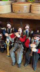 Woman browses traditional handicrafts at Yerevan souvenir shop
