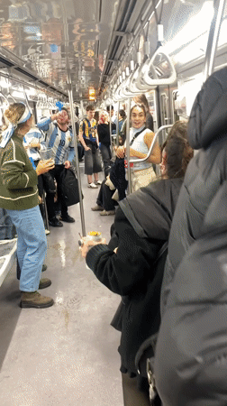Blue-and-white-clad fans pack a Buenos Aires subway car