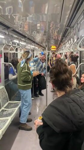Blue-and-white-clad fans pack a Buenos Aires subway car