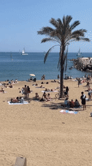 Crowds enjoy sunny day at Barcelona beach