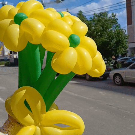 Yellow balloon flower bouquet photographed against a sunny Ukrainian sky