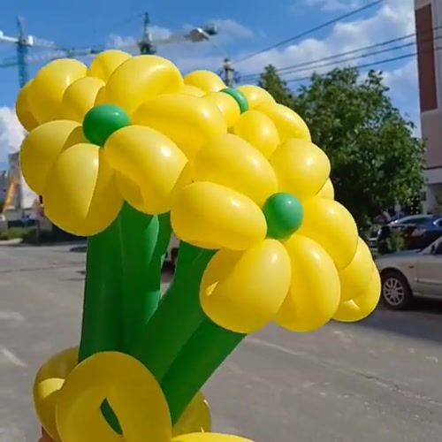 Yellow balloon flower bouquet photographed against a sunny Ukrainian sky