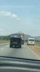 Van transports large wooden structure on Nigerian highway