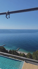 Ocean view captured through scaffolding on coastal morning
