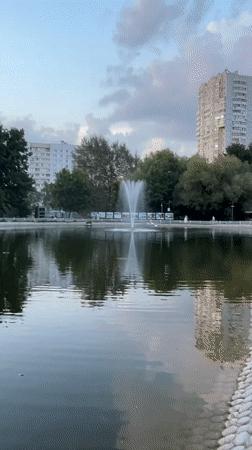 Moscow park in full summer-evening swing along the waterfront