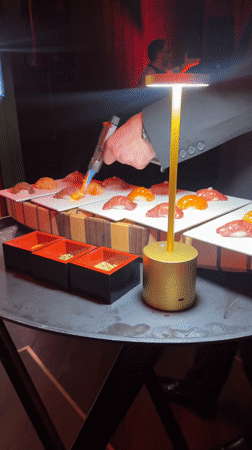 Chef torches sushi at Geneva restaurant dining service