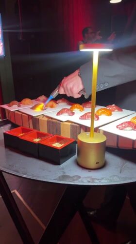 Chef torches sushi at Geneva restaurant dining service
