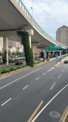 Street-level Shanghai: retail, traffic, and architecture on a July morning