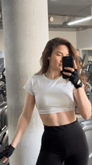 Woman takes mirror selfie video at Ufa gym