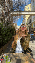 Woman enjoys brunch at outdoor cafe in Varna
