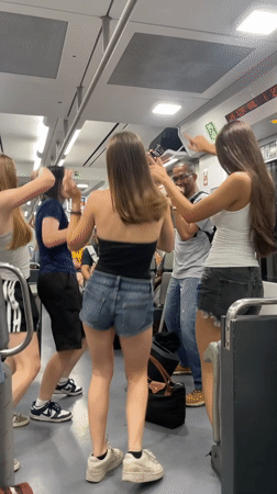 Passengers perform impromptu song and dance aboard moving train