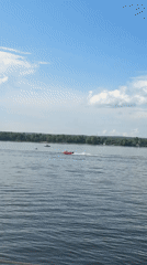 Speedboat racing event along Kama River embankment in Perm