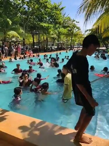 Water park busy with families during morning hours in Vietnam