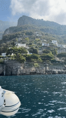 Boat passengers enjoy scenic Amalfi Coast waters near Positano