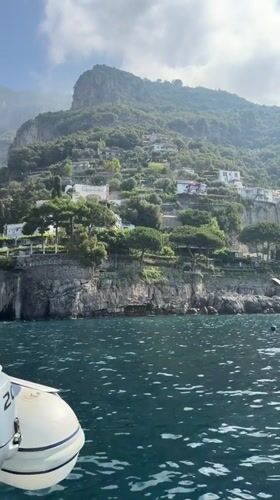 Boat passengers enjoy scenic Amalfi Coast waters near Positano