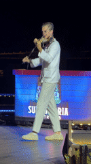 Electric violinist performs outdoor nighttime concert in Phú Quốc