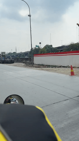 Motorcyclist documents morning commute through North Jakarta streets
