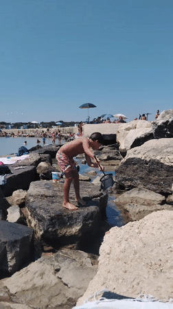 Lazy summer morning on Bari's rocky Adriatic shore