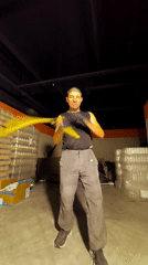 Yellow fan spinning practice in a Qarağandı warehouse