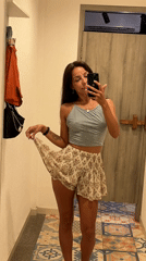 Woman takes mirror selfies in Kuta Selatan changing room