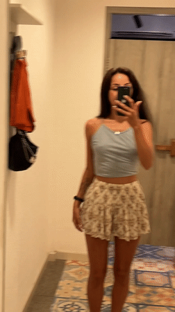 Woman takes mirror selfies in Kuta Selatan changing room
