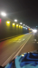 Motorcycle rider travels through tunnel in Maracay, Venezuela