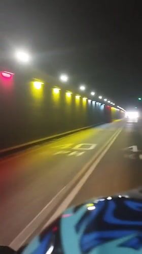 Motorcycle rider travels through tunnel in Maracay, Venezuela