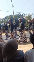 Traditional procession and street performance in Bancar, Indonesia