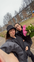 Two women film outdoor selfies in Votkinsk residential area