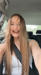 Woman enjoys music in car in Montenegro