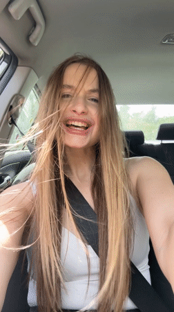 Woman enjoys music in car in Montenegro