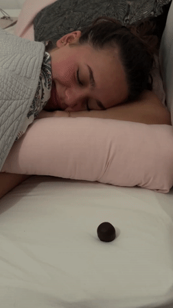 Woman wakes up in Milan bedroom with chocolate candy