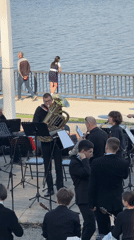 Orchestra performs outdoor concert by Kama River in Chaikovsky