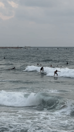 Surfing and park hangs along the Tel Aviv waterfront at dusk
