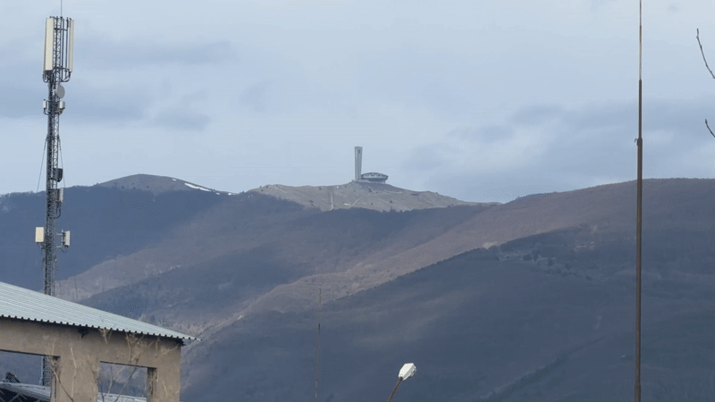 Buzludzha monument viewed from industrial area near Sheynovo, Bulgaria