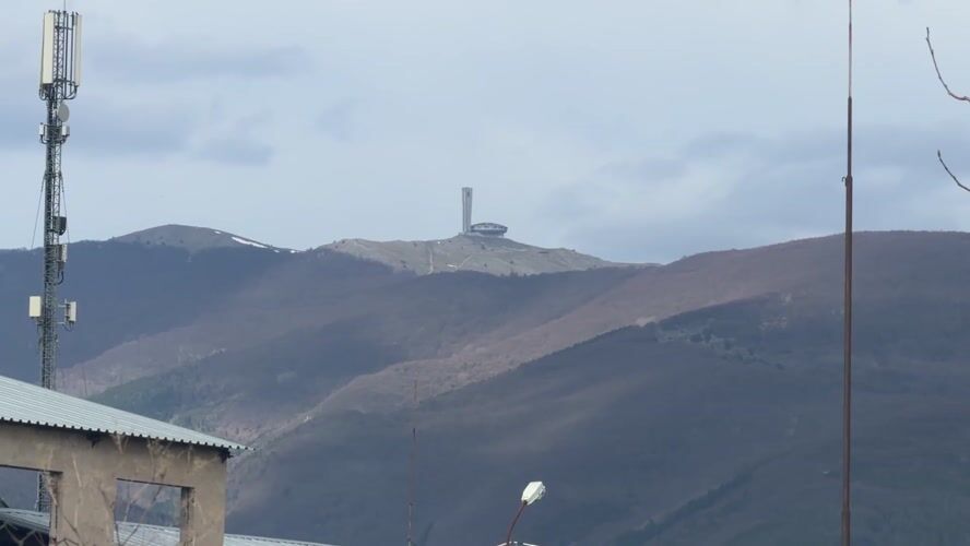 Buzludzha monument viewed from industrial area near Sheynovo, Bulgaria