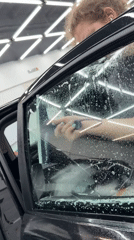 Early morning car detailing operations documented in Krasnoyarsk workshop