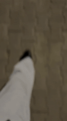Person walks on S-shaped concrete pavement in Boreti